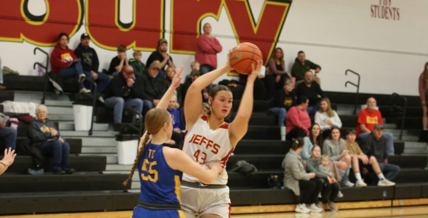 girl passing basketball