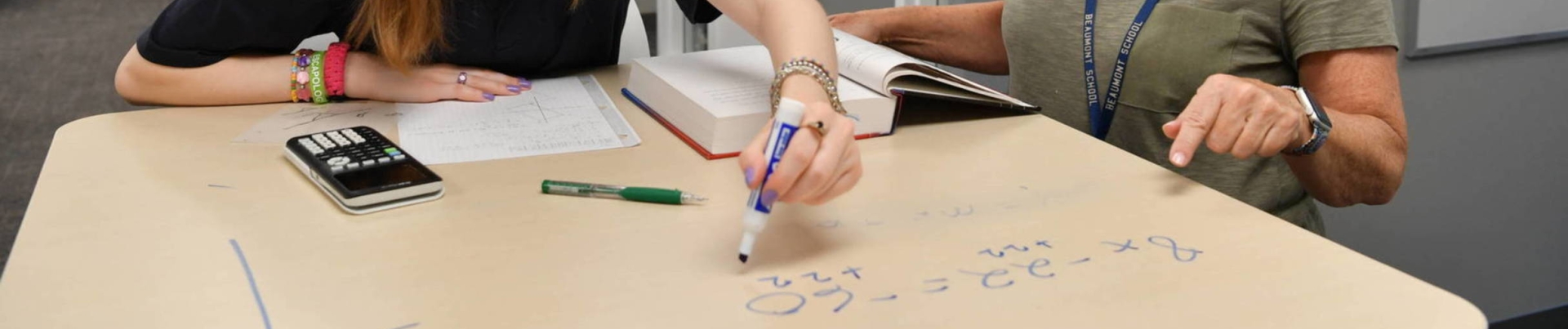 teacher tutoring math student