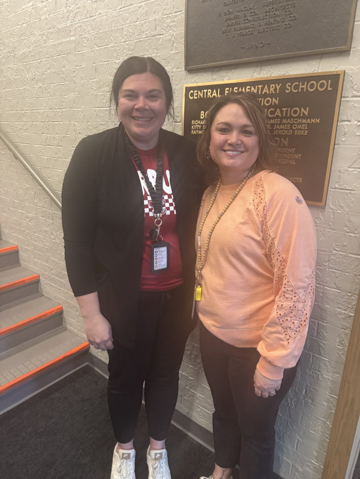 two teachers smiling